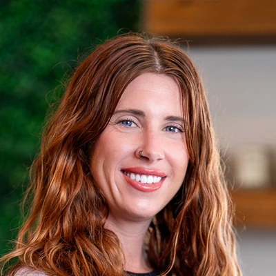 Close-up portrait of a person with long red hair