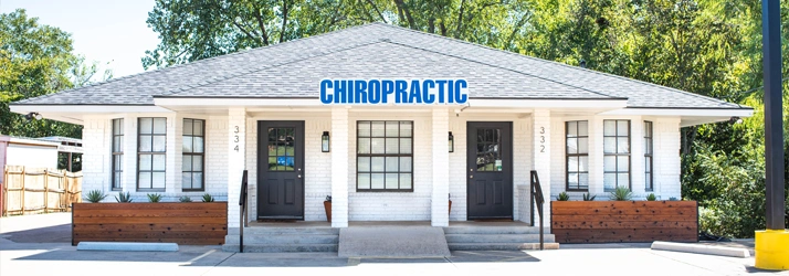 Front view of a small white brick chiropractic clinic