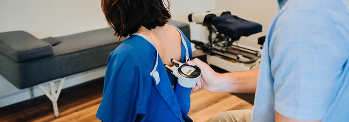 Person Being Evaluated By A Nervo-Scope Instrument